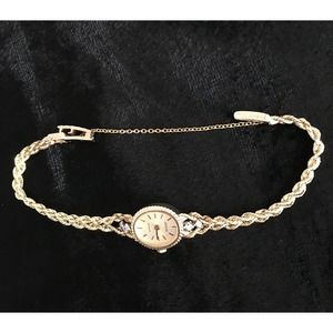Vintage Geneve 14K Yellow Gold Watch with diamond accents.